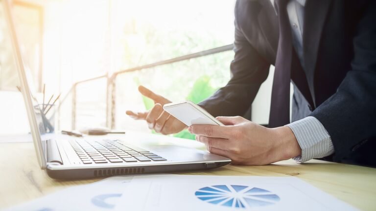 A small business owner using spreadsheets to manage his business inventory