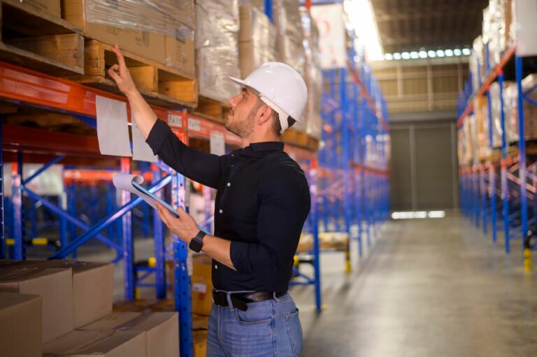 worker in warehouse doing lot number tracking