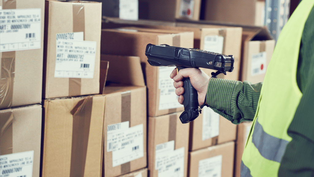 Warehouse worker scanning package barcodes