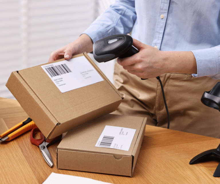 Person scanning packages with GTINs and barcode using barcode scanner