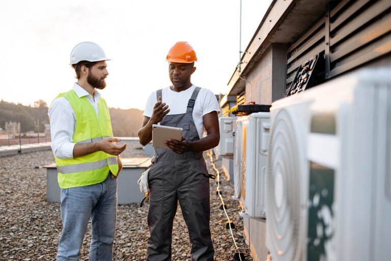 An-HVAC-field-service-technician-uses-the-best-HVAC-service-software-on-a-tablet