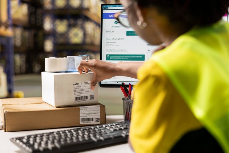 African american female verifying the shipment details on awb labels